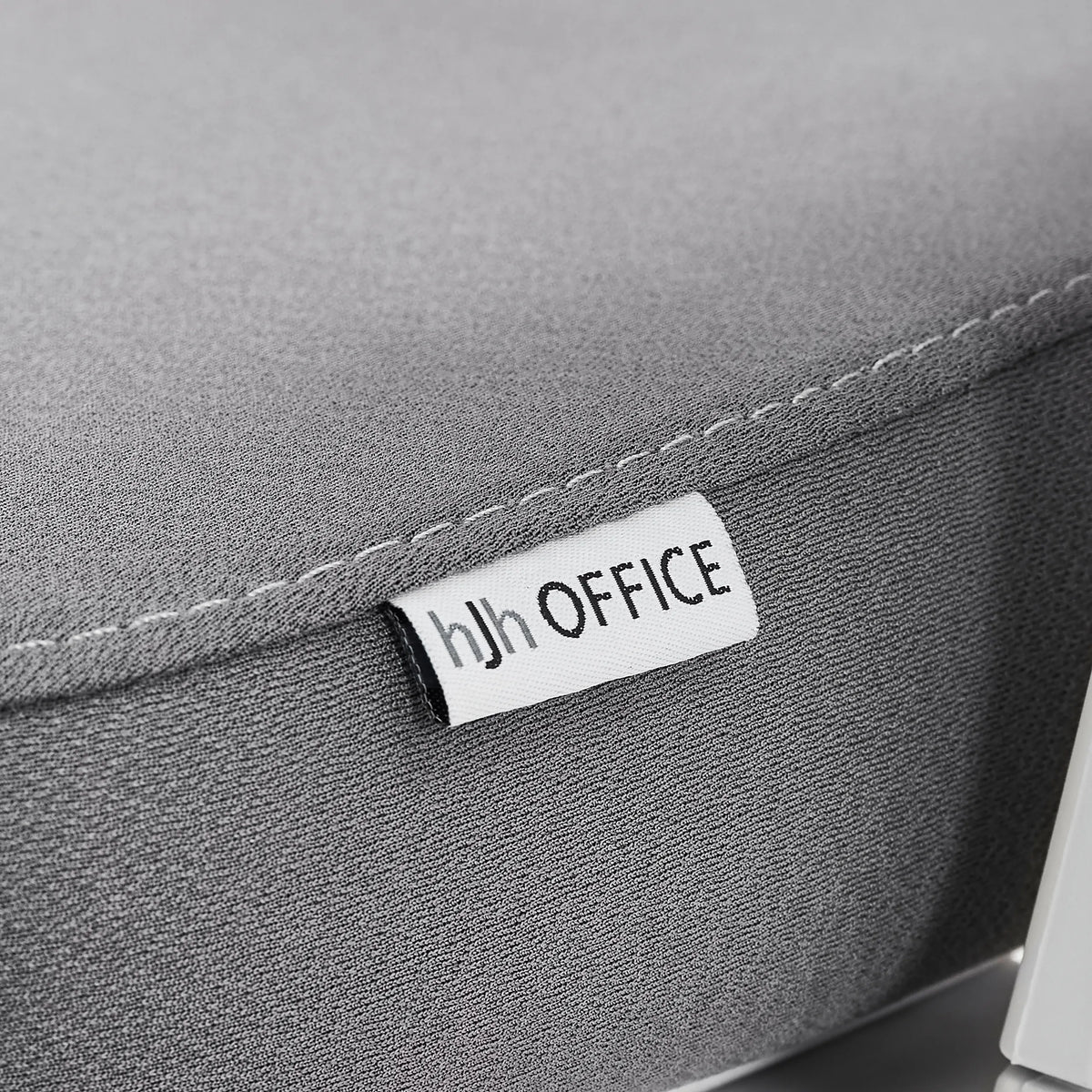 Etichetta del marchio sul rivestimento in tessuto grigio della sedia da ufficio professionale Ergomy WF 2 di hjh OFFICE