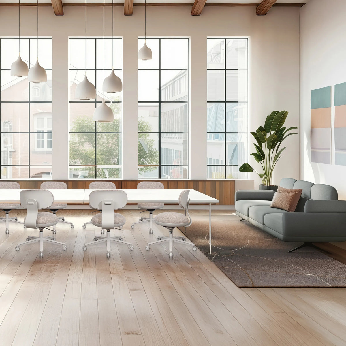 Sedia Home Office SITMOTION W in grigio con ruote e braccioli in una stanza luminosa di hjh OFFICE
