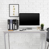 Scrivania bianca WORKSPACE I con dimensioni di 100 × 50 cm davanti a una parete di mattoni bianchi di hjh OFFICE