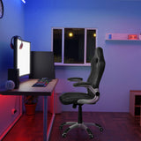 Sedia da gaming GAME SPORT nera con braccioli a una scrivania in una stanza illuminata di hjh OFFICE