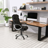 Poltrona Home Office RELAX BY155 in nero con braccioli davanti a una scrivania di MyBuero
