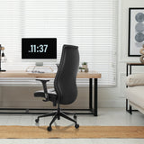 Poltrona professionale VITORO B nera in un ambiente di home office a una scrivania di hjh OFFICE