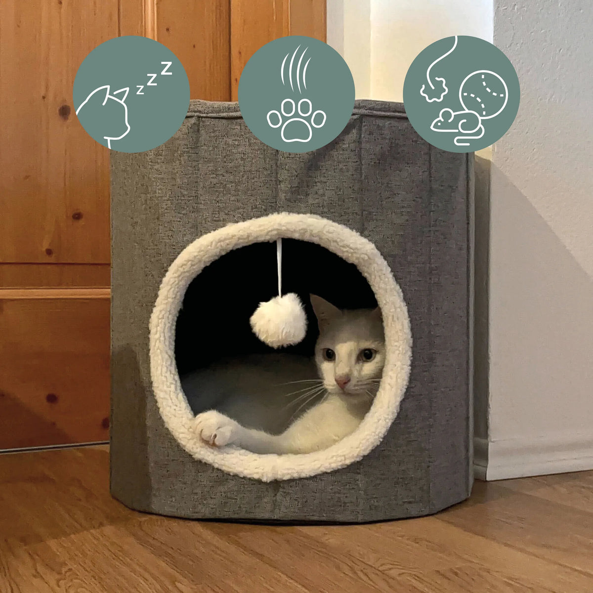 Cuccia chiusa per gatto PAWY R grigia con bordo in pelliccia bianca, pallina giocattolo integrata e un gatto all'interno di hjh LIVING