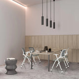 Sedie pieghevoli PRIORITY II W PU grigie a un tavolo da riunione in una stanza dal design moderno di hjh OFFICE