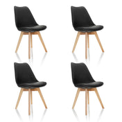 Quattro sedie a conchiglia SCANDI 4 nere con gambe in legno chiaro di hjh OFFICE